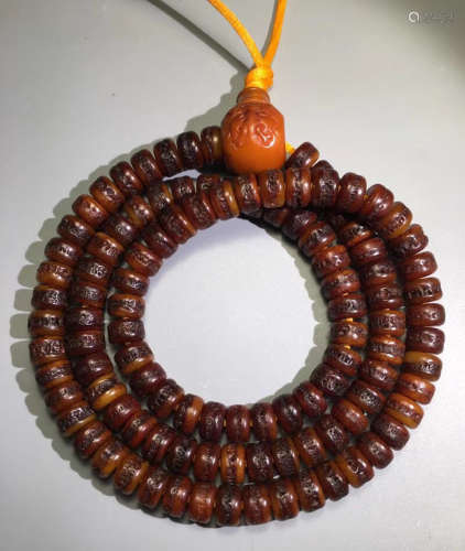 A BONE STRINGS NECKLACK WITH BEADS