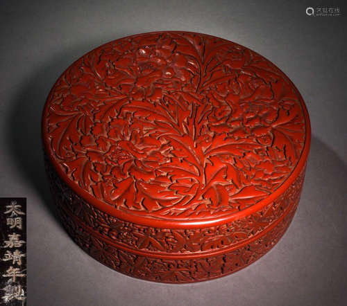 A RED LACQUER BOX CARVED WITH FLOWER PATTERN