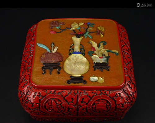 A RED LACQUER BOX EMBEDDED WITH GEM