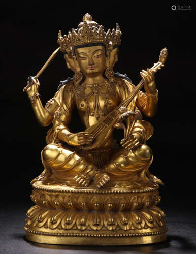 A GILT BRONZE FIGURE