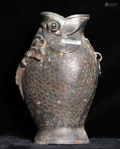 A LEAD ORNAMENT SHAPED WITH FISH