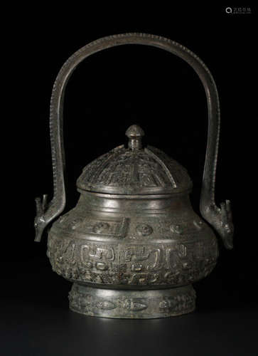 A BRONZE CARVED POT