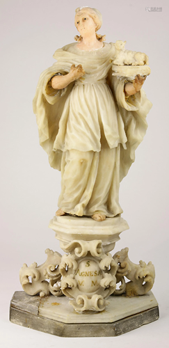 An Italian stone carved sculpture depicting St Agnes