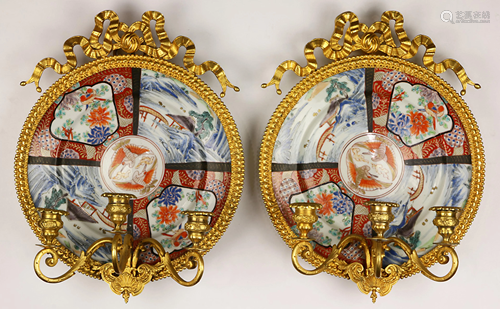 A pair of ormolu mounted girandoles