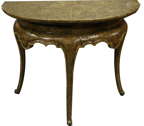 A contemporary demilune hall table