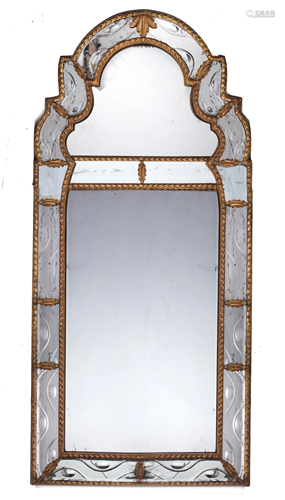 A continental ebonized and partial gilt hall mirror