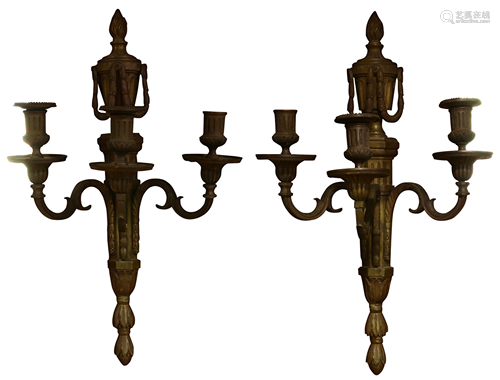 A pair of French Louis XVI patinated bronze sconces