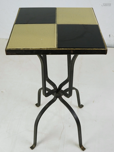 A pair of tile top bistro tables