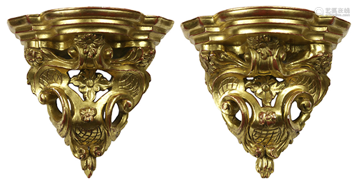 A pair of Italian Rococco giltwood carved wall brackets