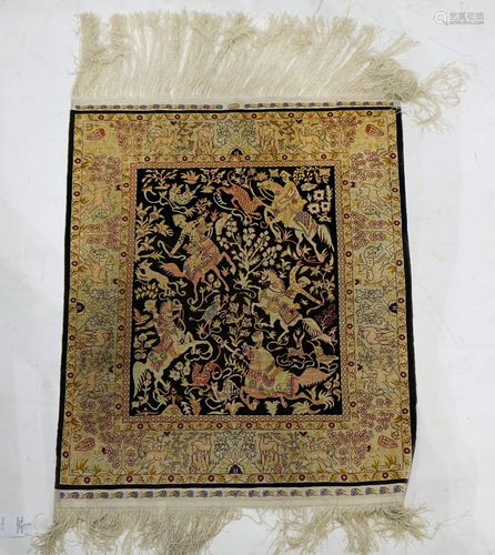 A fine silk Hereke rug, signed