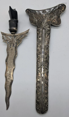 A pair of silver and horn kris daggers, filigree sil…