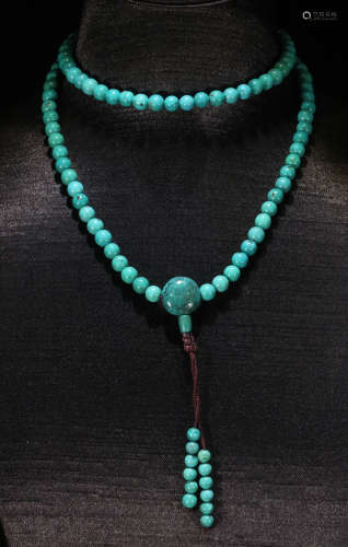 A TURQUOISE NECKLACE WITH 108 BEADS