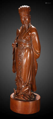 A HUANGYANG WOOD CARVED ZHUGELIANG FIGURE