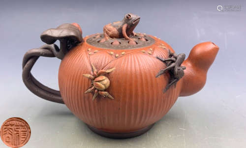 A ZISHA POT CARVED WITH BEAST AND LOTUS