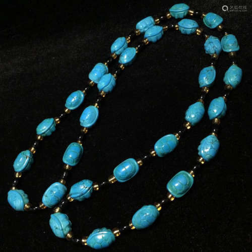 A TURQUOISE NECKLACE WITH AUSPICIOUS PATTERN
