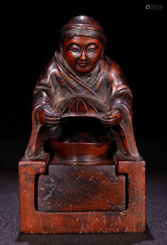 A HUANGYANG WOOD SEAL CARVED WITH ZHAOCAI FIGURE