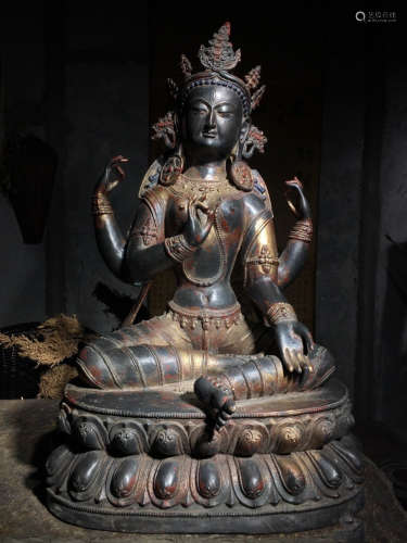 A COPPER GUANYIN BUDDHA WITH MULTIPLE HANDS