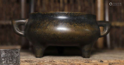 A COPPER TRIPOD CENSER