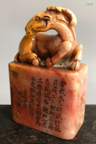 A SOAPSTONE SEAL CARVED WITH DEER