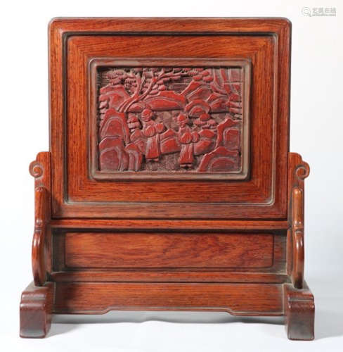A HUANGHUALI WITH RED LACQUER SCREEN CARVED WITH FIGURE