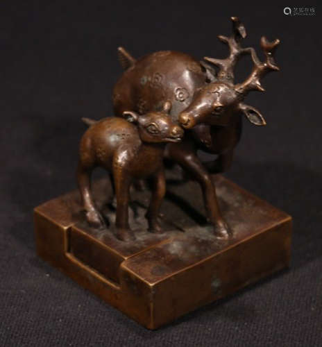 A COPPER SEAL CARVED WITH DEER