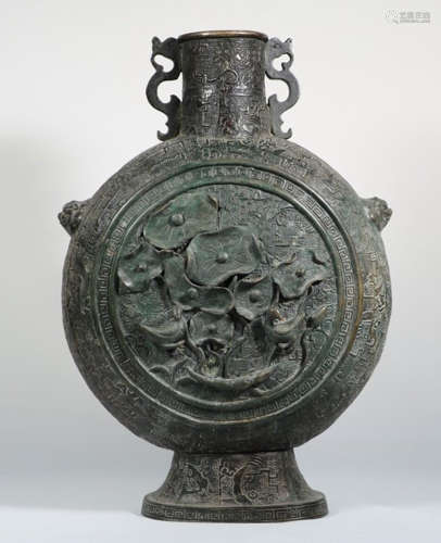 A COPPER VASE WITH FLOWER AND BIRD