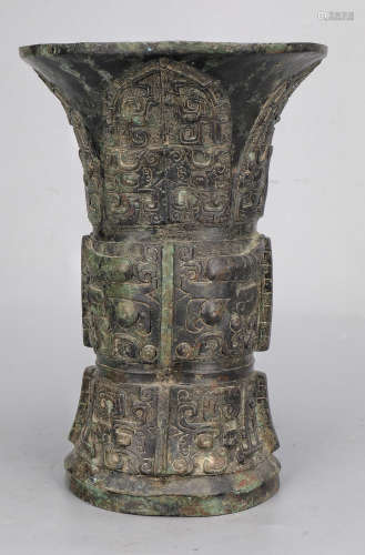 A COPPER VASE WITH BEAST PATTERN
