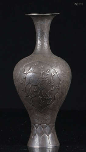 A SILVER VASE CARVED WITH DEER