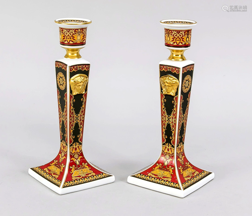 A pair of candle holders,