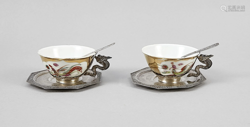 Two teacups with saucers,