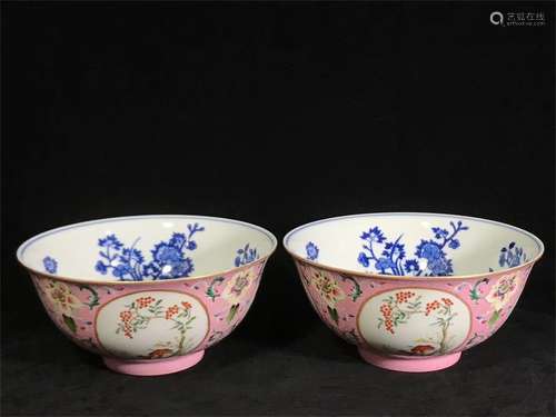 A pair of flower bowls with blue and white flowers and windows