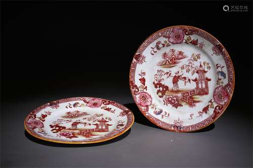 A pair of alum red character plates