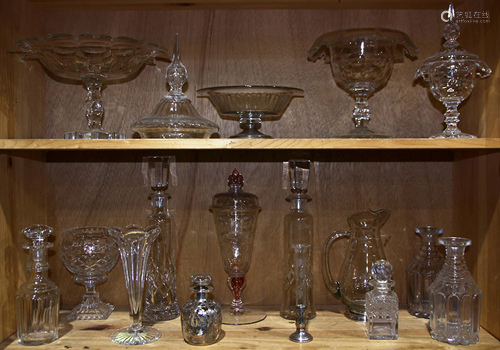 Two shelves of crystal table articles