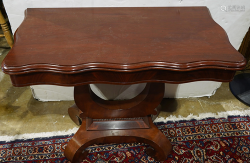 An Empire style mahogany flip top table