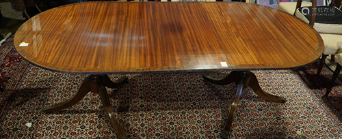 A Regency style mahogany dining table