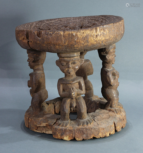 Cameroon carved wood stool with four figures