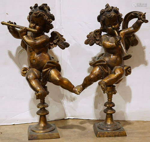 Pair of Rococo style gilt metal figural sculptures of