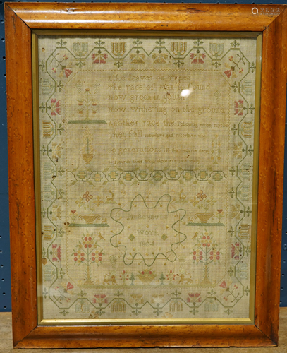 A framed 1804 sampler