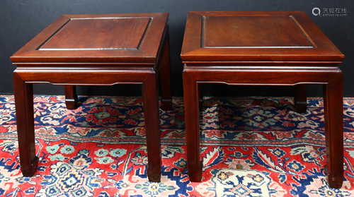 A pair of two Chinese hardwood low tables