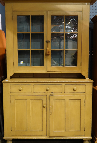 An American Provincial paint decorated cabinet first