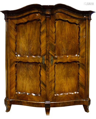 A Continental walnut armoire