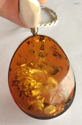 A Big Amber Pendant with Silver Frame, 2 1/4