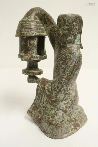 A Chinese archaic style bronze sculpture depicting