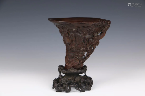 A CARVED EAGLEWOOD LIBATION CUP