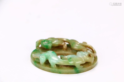 A CARVED JADEITE CHI-DRAGON PENDANT