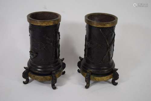 Pair of bronze urns with a black patina, decorated…