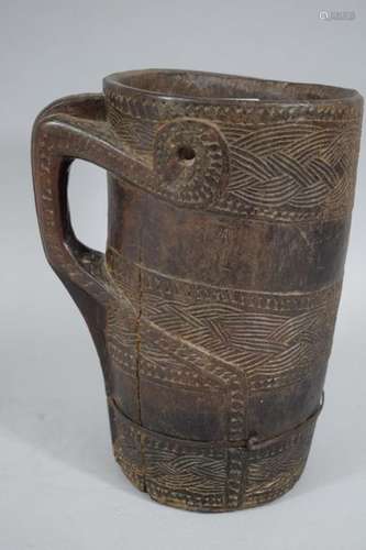 TIBET/ NEPAL, 20th century \nCarved wooden milk jug…