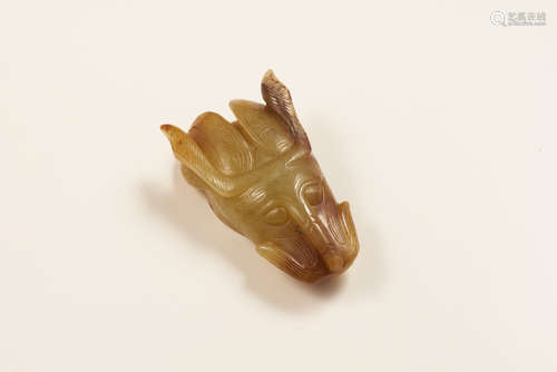 A Jade Carved Dragon Ornament. 
Han Dynasty.