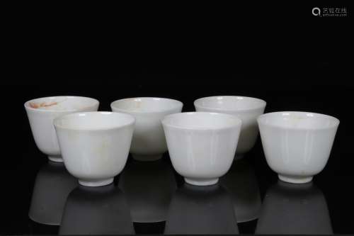GROUP OF SIX WHITE GLAZED CUPS