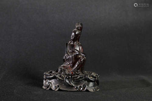 AMBER CARVED 'GUANYIN' SEATED FIGURE